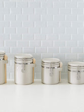 Load image into Gallery viewer, 4 Piece Ceramic Canisters with Easy Open Air-Tight Clamp Top Lid and Wooden Spoons, Beige
