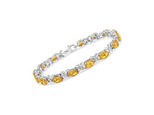 Load image into Gallery viewer, .925 Sterling Silver 7 x 5 Mm Oval Cut Orange Citrine And 1/20 Cttw Round Cut Diamond Fashion Tennis Bracelet