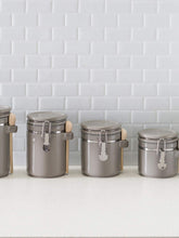 Load image into Gallery viewer, 4 Piece Ceramic Canisters with Easy Open Air-Tight Clamp Top Lid and Wooden Spoons, Grey